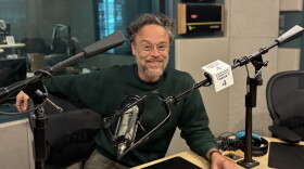 Rodrigo Amarante sitting down for an interview at WUNC’s studios at the American Tobacco Historic District in Durham.