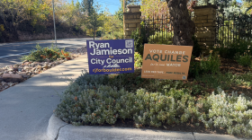 A sign endorsing Ryan Jamieson for city council is next to a sign endorsing Aquiles La Grave in Boulder’s mayoral race at the intersection of 11th Street and Baseline Road in Boulder on Oct. 21, 2026.