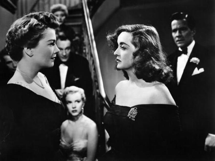 Eve Harrington, played by Anne Baxter (left), and Margo Channing, played by Bette Davis, face off in a scene from Joseph L Mankiewicz's 1955 movie, <em>All About Eve</em>.