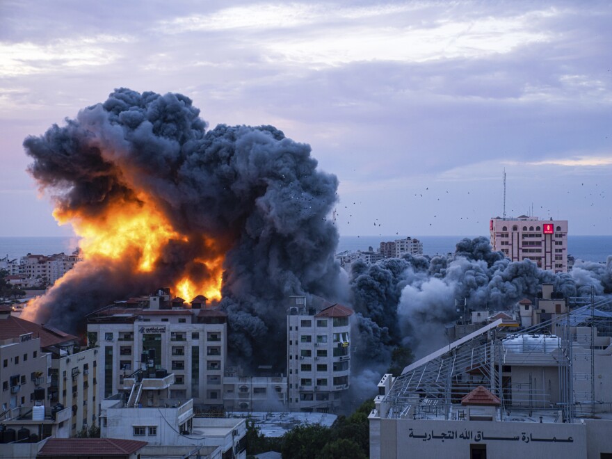 Fire and smoke rises following an Israeli airstrike, in Gaza City, Saturday, Oct. 7, 2023.