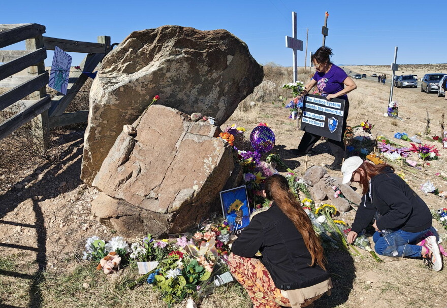 Protesters tend to memorials for Epstein abuse survivors outside the front gate of the sex offender's former Zorro Ranch southeast of Santa Fe. Te site is host to several allegations og abuse going back decades.