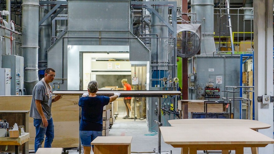 In the Gat Creek finishing room, each piece of furniture will get its final finish lacquer sprayed on by robots in an ultra-clean environment. This ensures consistency and freedom from dust and other contaminants.