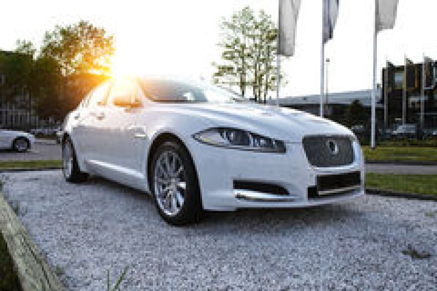 car-sunset-background-view-modern-jaguar-xf-40447757.jpg