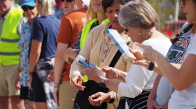 Members of the Kimball Junction library book brigade pass books to one another Oct. 3, 2026.