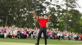 Tiger Woods celebrates after making his putt on the 18th green to win the Masters at Augusta National Golf Club on April 14, 2019, in Augusta, Ga. (Kevin C. Cox/Getty Images)