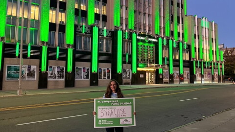 Barbara Shepard in front of the Niagara Mohawk Power Corporation building