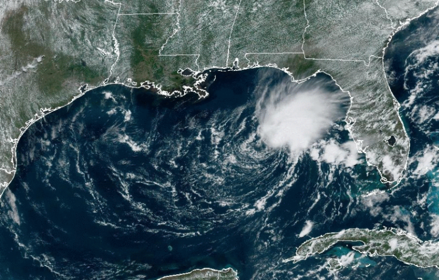 This satellite image, altered to indicate state and national borders, shows Tropical Storm Arlene in the eastern Gulf of Mexico early Friday afternoon.