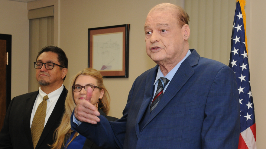 Tom Horne speaking at podium