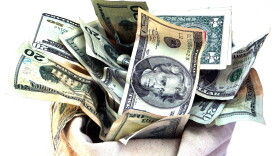 Open bag of US currency.