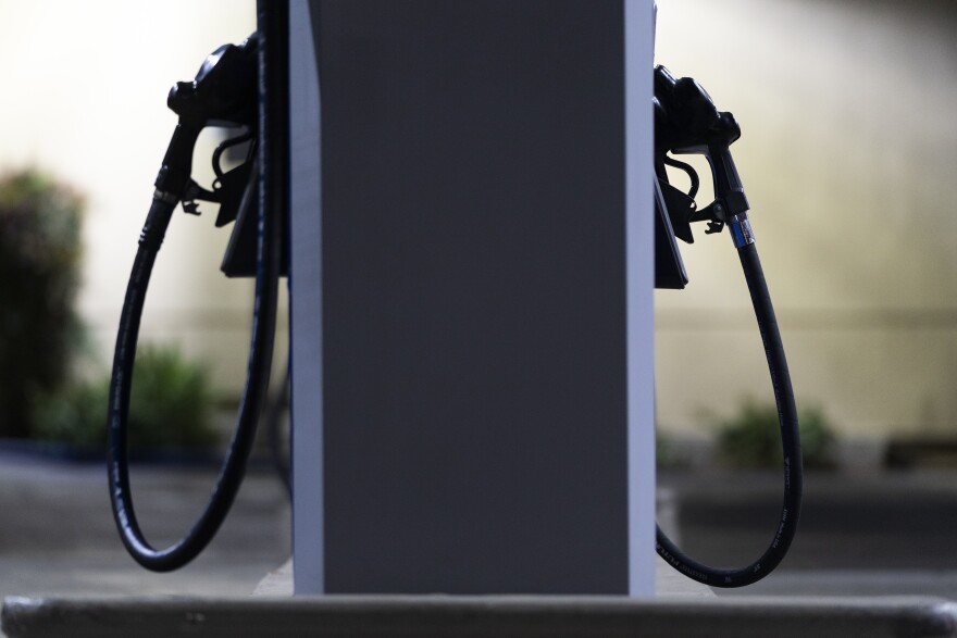 FILE - Gas nozzles are pictured at a Mobil gas station in West Hollywood, Calif., Tuesday, March 8, 2022. (AP Photo/Jae C. Hong)