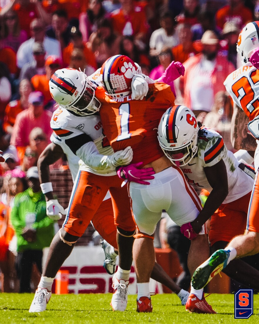 Marlowe Wax (2) and the Syracuse defense tackle Clemson’s Will Shipley (1). Shipley finished the day with 172 rushing yards, two touchdowns and a fumble.