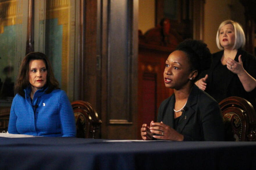 Dr. Joneigh Khaldun, far right, at a press conference during the pandemic. 