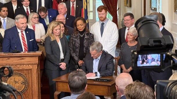 Gov. Josh Stein signs House Bill 696 into law on Thursday, April 30 at the North Carolina Governor's Mansion. The legislation provides $319 million to fund the state's Medicaid program for the rest of this fiscal year.