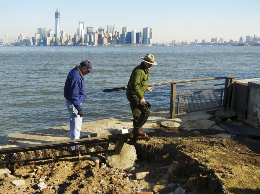 Interior Secretary Ken Salazar (left) and Statue of Liberty National Monument Superintendent David Luchsinger tour flood damage on Liberty Island on Thursday.