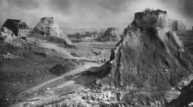 "Spite Mounds," 1910. The most famous image of the Denny Regrade is often described as depicting "spite mounds." But writer David Williams says, at least in one case, it wasn't spite at all that kept these mounds standing. Just paperwork.