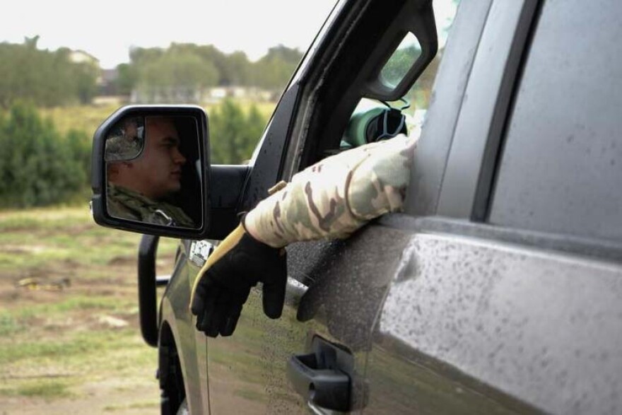 National Guard Specialist Joshua Smoak, a camera operator, sits inside a Mobile Video Surveillance System Truck in Rio Grande City, Texas.