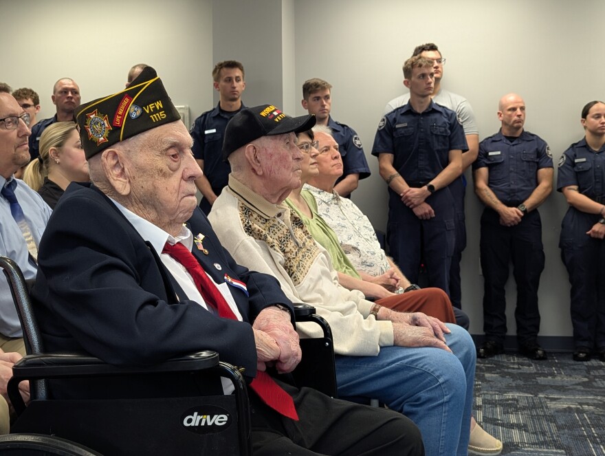 James Flinchum (left) and George Hubbard (center) at a ceremony recognizing their service in World War Two at the Roanoke Police Department on June 2, 2026.