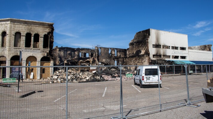 Crews demolished unstable walls on the west block of Gatesville's Historic Downtown Square following a fire Monday, March 16, 2026. The fire originated in the Gatesville Messenger building, now mostly destroyed.