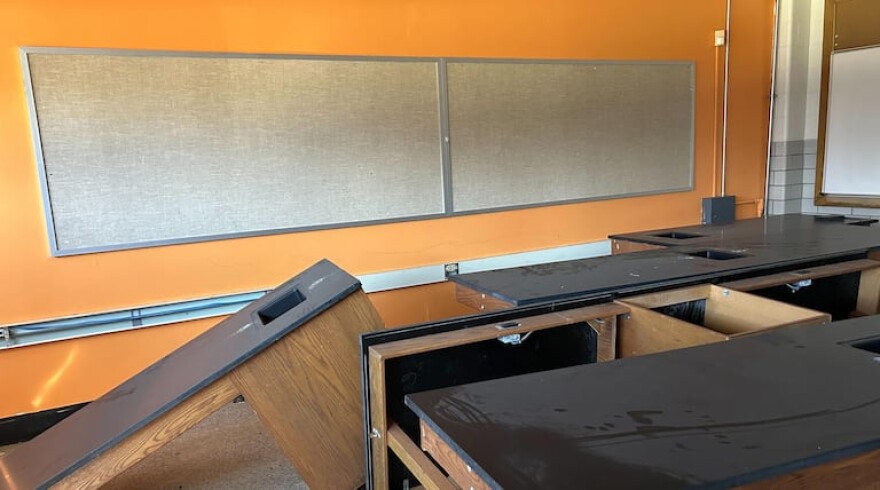 Desks sit collecting dust in a classroom on Thurs., Feb. 8, 2024 at the former School 11, which a charter school used for two years before selling the building in Indianapolis, Indiana.