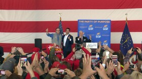 Donald Trump Jr., center, rallies in Greenfield, Indiana, with Republican Senate candidate Mike Braun, left, and 6th Congressional District candidate Greg Pence, right.