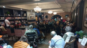 Residents of The Lafayette (shown here at a Nov. 18 tenants meeting) don't have to be concerned about the property owner opening their dining facility to the public anymore, but a plan to begin charging them for meals is still on the table.