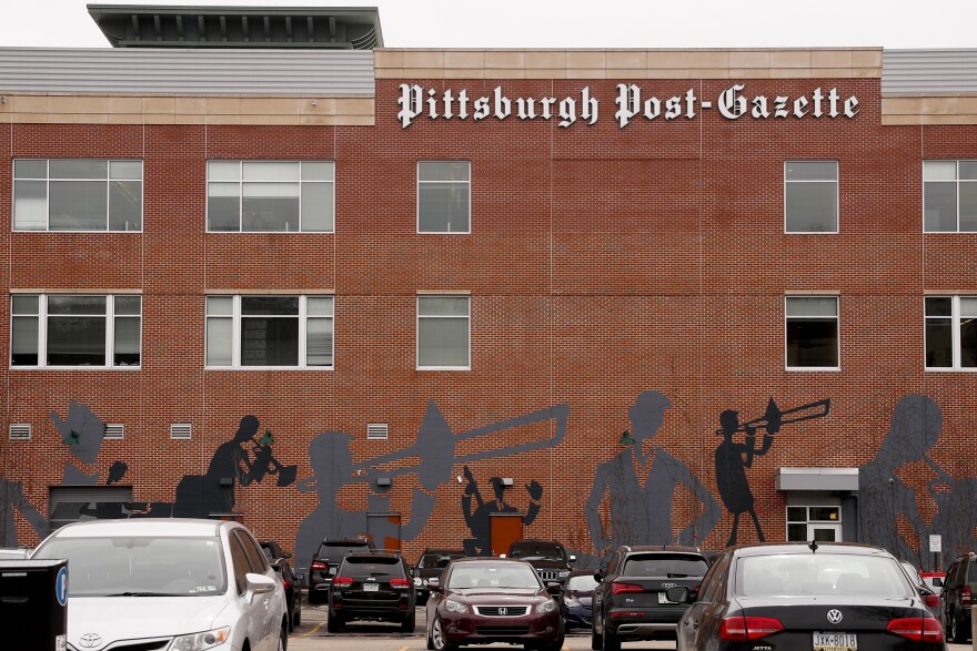 Cars are parked near the building where the offices of the Pittsburgh Post-Gazette on Thursday, Feb. 14, 2019, in Pittsburgh.