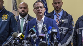 Gov. Josh Shapiro, center, speaks during a press conference regarding the arrest of suspect Luigi Mangione, Monday, Dec. 9, 2024, in Hollidaysburg, Pa., in the fatal shooting of UnitedHealthcare CEO Brian Thompson.