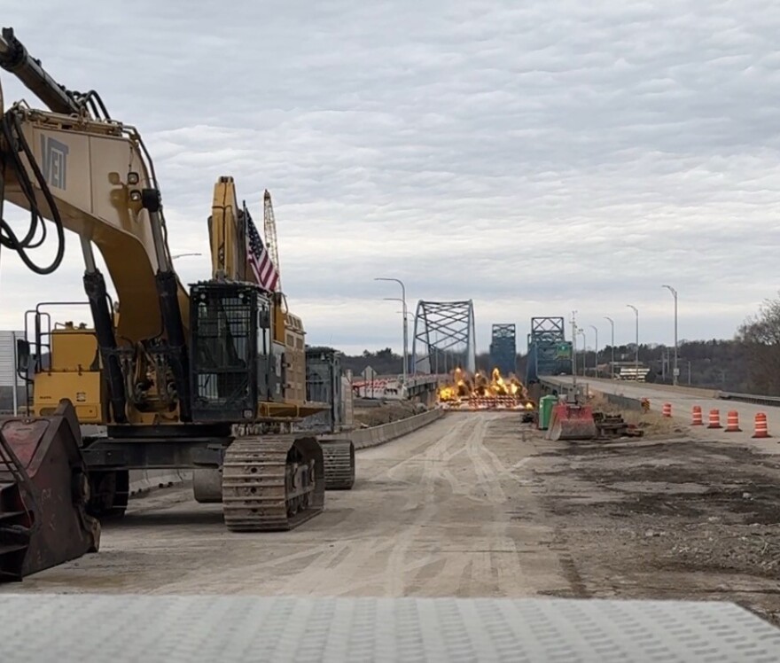 A view of the McClugage Bridge during the first demolition on March 27. Construction equipment and dirt sits on the structure, with heavy construction machinery in the foreground.