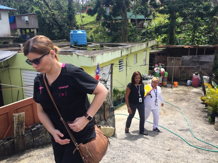 Dr. Carla Rossotti (left), a general practitioner, and her health care team leave the home of the their patient, 37-year-old Osvaldo Daniel Martinez. He has the symptoms of a degenerative disease, Rossotti says, but he needs a neurologist's evaluation before he can get proper treatment.