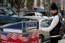 A Castro resident places his ballot in a box located outside of the Eureka Valley Recreation Center. 