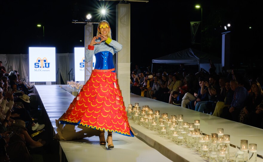 At the McDCouture runway show at St. Thomas University on March 26, the winning look titled “Wrapped in Smiles” by Ignacio Lopez, a senior at St. Thomas in fashion merchandising, stood out for its use of cardboard from Happy Meal boxes design.
