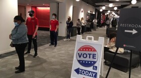People standing in line at polling site