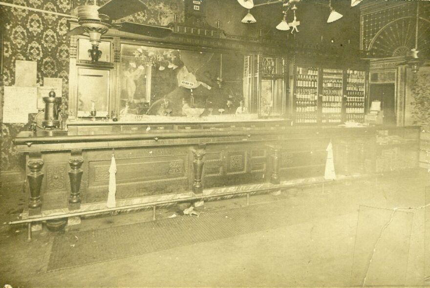 A photograph showing the Carey Hotel Bar in Wichita, Kansas on Dec. 27, 1900, after Carry Nation threw rocks to break the mirror during a temperance protest.