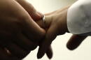 A couple exchanges wedding bands at City Hall in Philadelphia, Oct. 11, 2018. (Matt Rourke/AP)