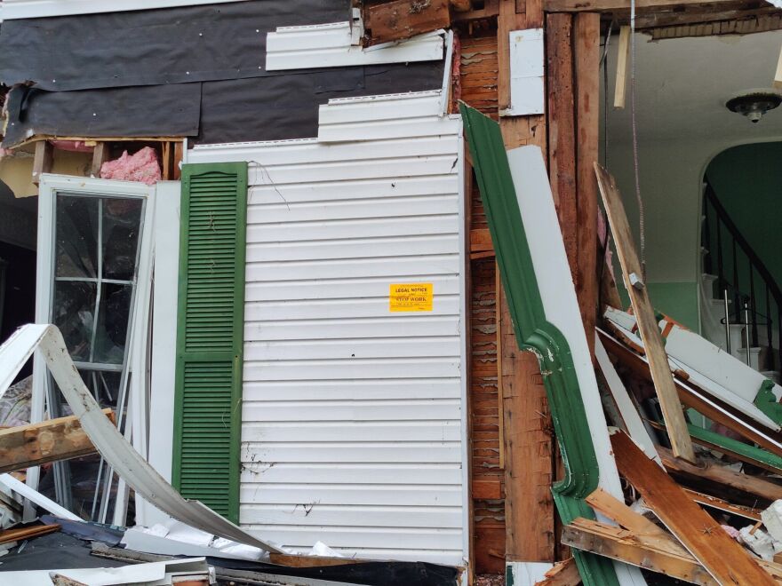 Seneca County officials arrived on scene and issued a stop work order, still visible on the front of the house. Workers continued with the demolition despite the order.