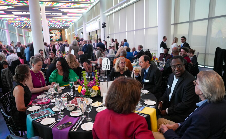 Guests sit at tables in a filled ballroom at Energizer Park for the 2026 Hear the Future gala.