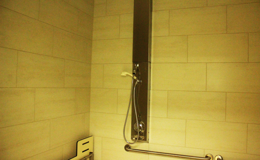 An ADA shower room that's located inside the intake space.