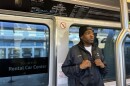 James Paxton, a Case Manager for LifeMoves, rides the AirTrain during an early morning homeless outreach trip to SFO.