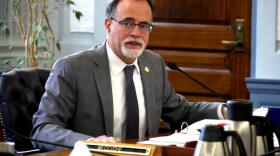 a man at a table in a suit