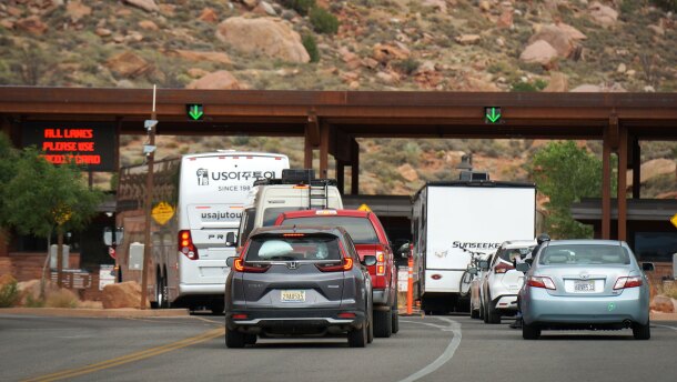 A line of vehicles wait to enter Zion National Park at the entrance outside of Springdale in southern Utah, June 9, 2025.