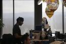 Employees work at their desks in Redwood City, Calif., Monday, Jan. 30, 2017. (Jeff Chiu/AP)