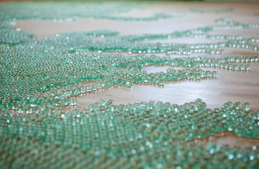 Artist Maya Lin made a map of the Chesapeake Bay using blue-green marbles.