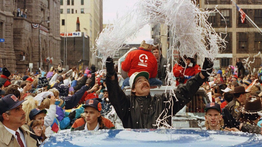 Minnesota Twins pitcher Jack Morris tosses confetti from his pickup truck during a parade celebrating the team's 1991 World Series championship.