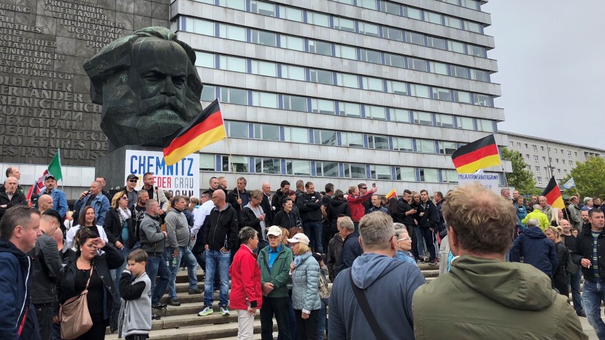 Far-right demonstrators gather in front of the Karl Marx Monument in the German city of Chemnitz on Saturday.