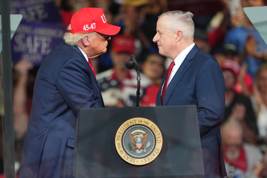 Michael Whatley and President Trump greet each other during a campaign rally at the Gastonia Municipal Airport, Wednesday, Sept. 16, 2026, in Gastonia, N.C.