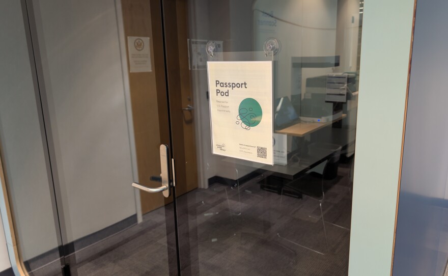 clear glass door to an office space. sign reads "passport pod"