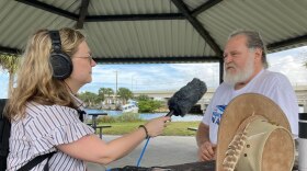 Central Florida Public Media's environment reporter Molly Duerig interviews a source in the field.