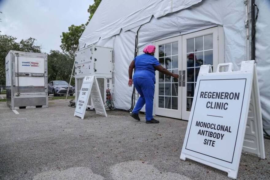 A worker enters a Regeneron clinic treatment site in Pembroke Pines at C.B. Smith Park on Wednesday, August 18, 2021. 