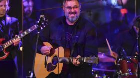 Musician Vince Gill performs at the Facing Addiction with NCADD gala at the Rainbow Room on Monday, Oct. 8, 2018, in New York. (Evan Agostini/Invision/AP)