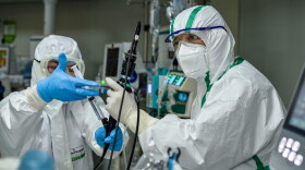 We discuss why thousands of health care workers in China seem to be bearing the brunt of the coronavirus. (STR/AFP via Getty Images)